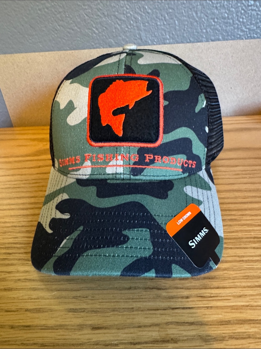 Men’s Simms brand snap back trucker hat in cool camo , black and simms orange